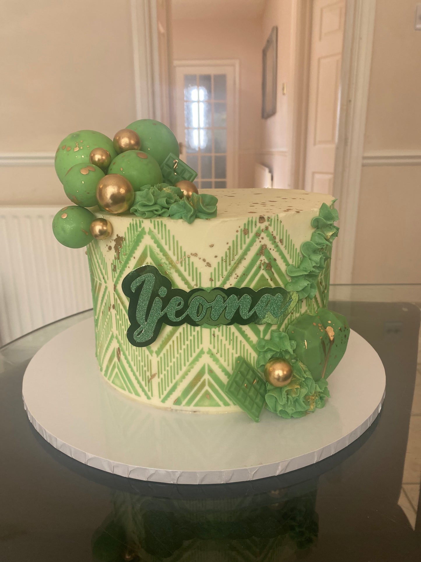 Cream cake with green stencil