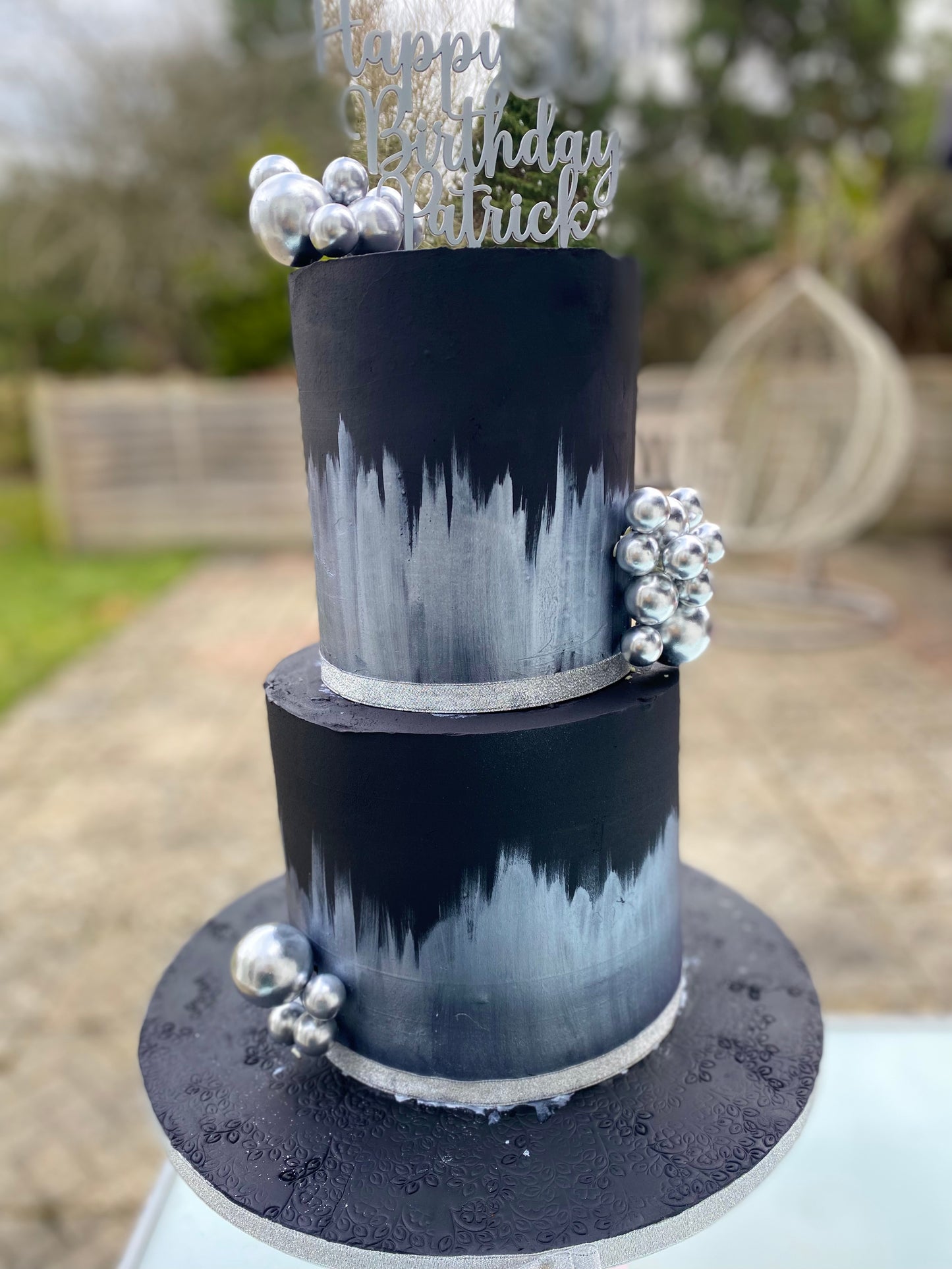 Black cake with silver accents