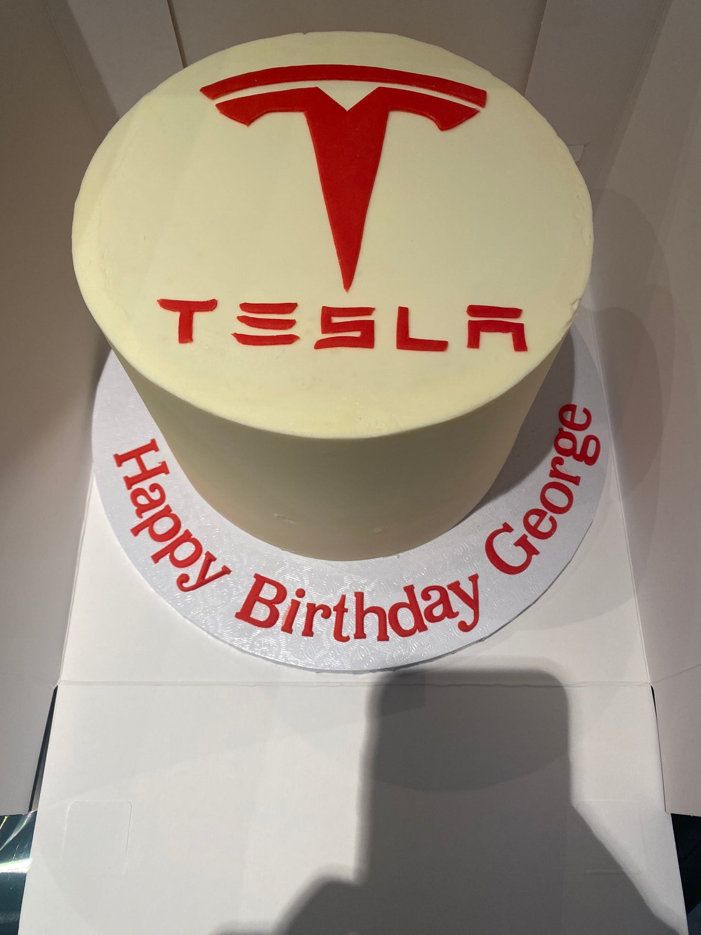 Tesla logo cake