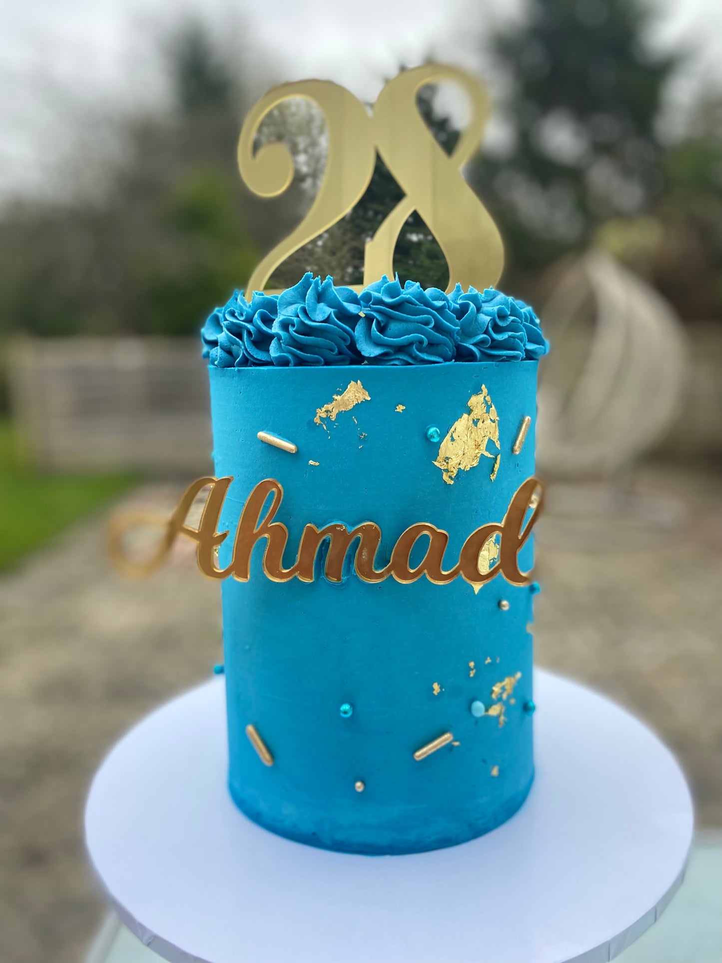 Deep blue and gold cake